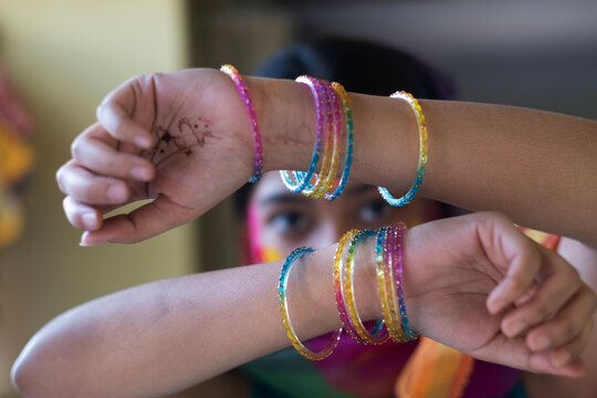 Colourful face smudged with colourful powders in holi festival