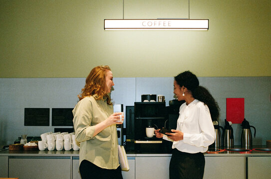 Business Colleagues Talking at Office Coffee Station
