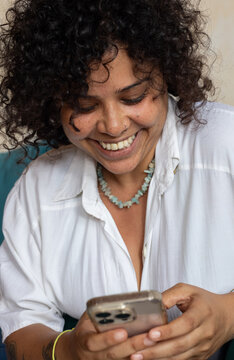 portrait of smiling woman using smartphone, typing message