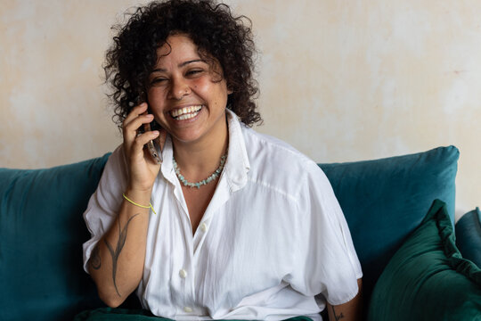 portrait of smiling woman talking on the phone
