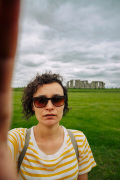 Selfie portrait of young woman at Stonehenge, UK