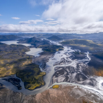 Aerial view of glacial river delta and volcanic peaks, Iceland