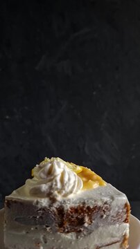 Vertical Clip of Slice of Lemon Blueberry Cake Spinning on a White Plate