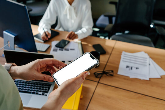 Colleague Using Smartphone with Blank Screen During Workday