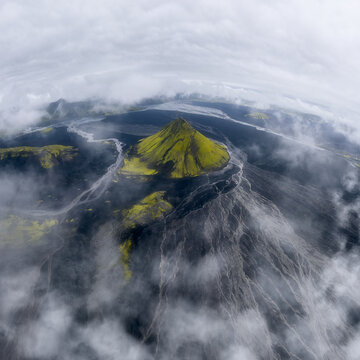 M&aelig;lifell volcano emerging through clouds, Iceland highlands