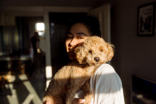 Portrait of a young woman with a dog