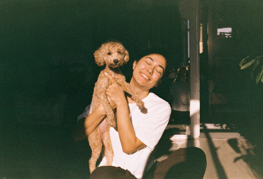 Portrait of a young woman with a dog