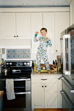 Funny Little Kid Dances on Kitchen Counter