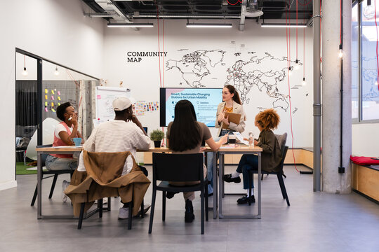 Diverse team discusses urban mobility strategies