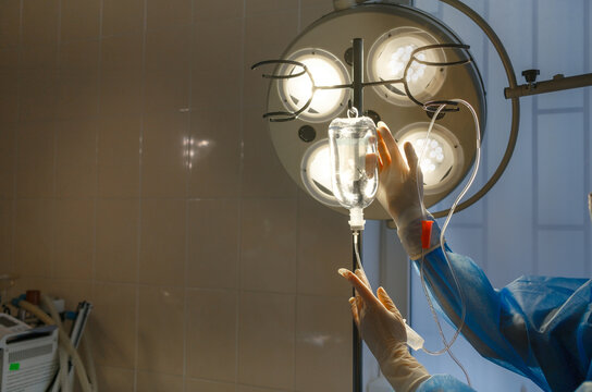 the nurse puts an IV in