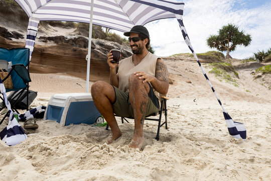 UGC Man drinking mate on beach in Australia