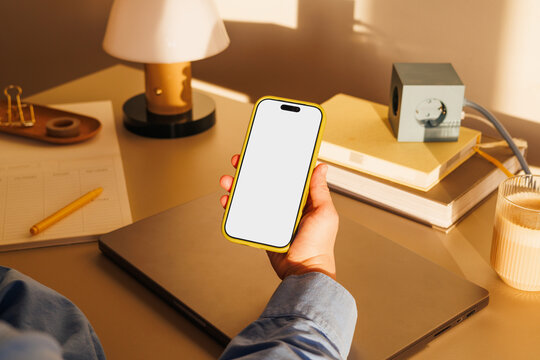 Business office workspace with smartphone white screen mockup