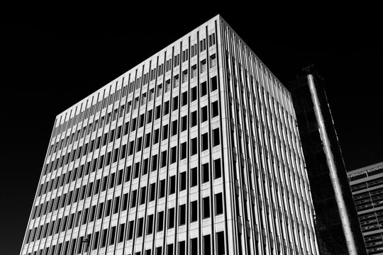 Building Stands Tall Against Black Sky During Daytime Hours