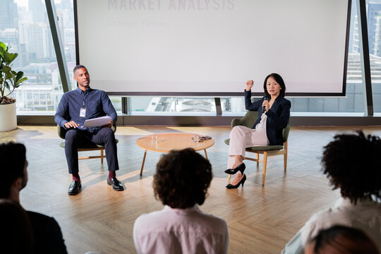 Business presentation on market analysis to an audience.