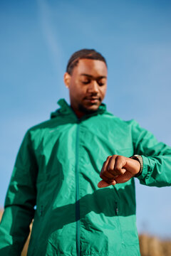 Black Man Checking Smartwatch 