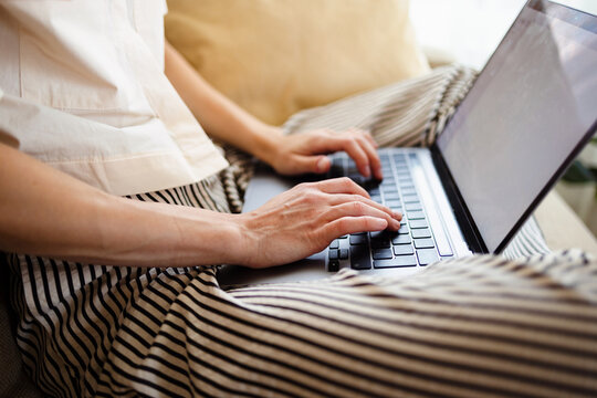 Person Typing On Laptop While Working From Home