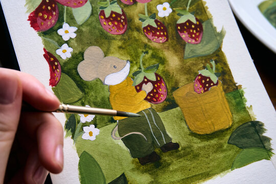 Woman painting her illustration