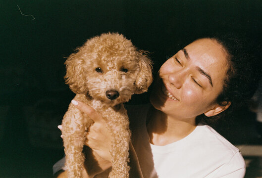 Portrait of a young woman with a dog