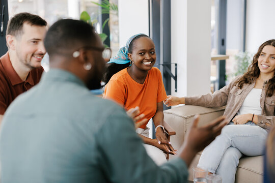 Group of Friends Talking and Enjoying Time Together in a Cafe