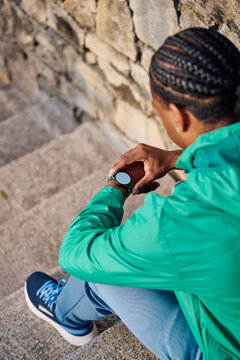 Black Man Checking Smartwatch 