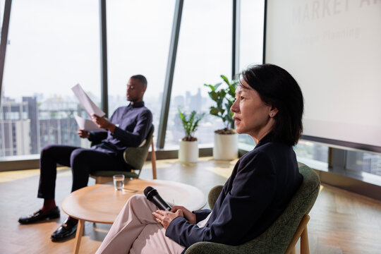 Business professionals at a market analysis presentation.