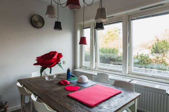 Creative home studio workspace with handmade giant rose