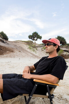 Portrait of a Man sitting on beach chair in Australia