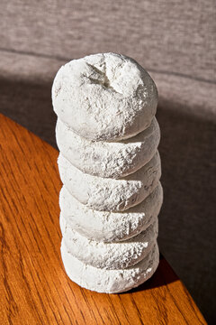 Vertical Stack of Powder Sugar Donuts