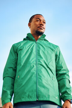 Portrait of young black adult looking at the camera outside