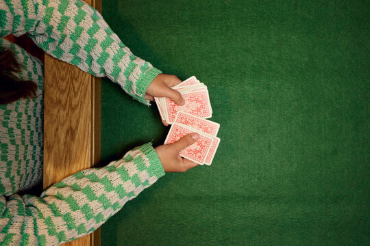 Anonymous woman deals cards