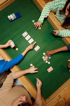 Table set for poker with chips and revealed cards