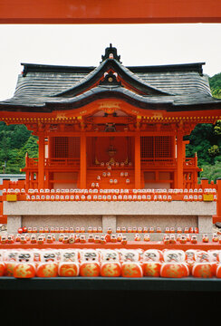 Film Photo of Red Shinto Shrine with Daruma Dolls, Kyoto Japan
