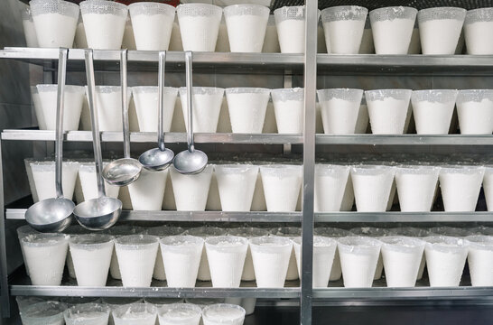 Traditional artisan cheesemaking process making fresh soft cheese
