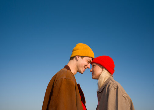 Young Couple Share a Moment Under a Clear Sky