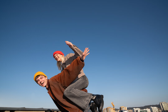 Young Couple Enjoys Fun Moment At Urban Surroundings