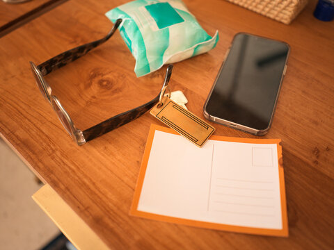 Hotel Room side table with Sunglasses, Phone, and Hotel Room Key