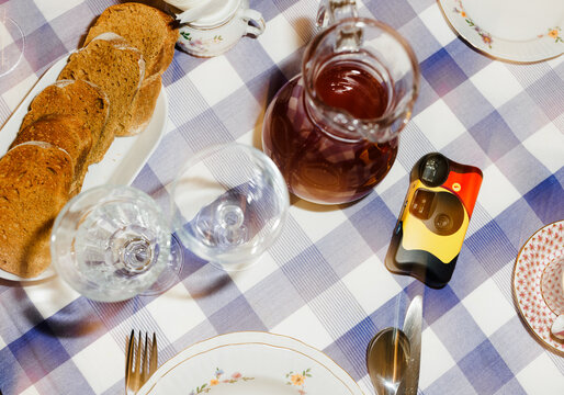 Table Setting With Food and Drink at a Gathering in a Home