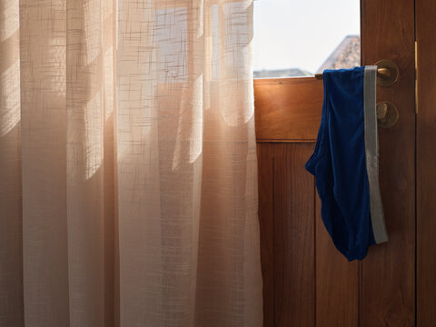 Knickers Hanging on door int hotel inMorning Light to dry