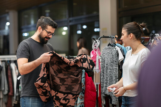 People Shop for Clothes on an Urban Market