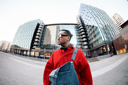 Young man posing in urban street style with fisheye effect