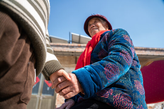 Grandmother and grandson holding hands