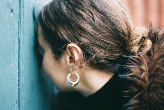 Woman Peering Through Keyhole on 35mm Film