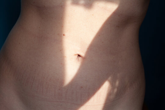 Female belly in the sunlight 
