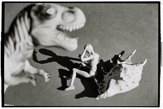 Toy figures show a scene of fear in a dinosaur attack