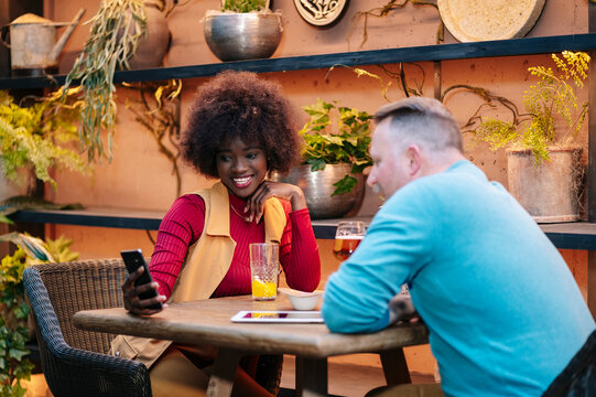 Diverse couple enjoying social interaction at restaurant bar