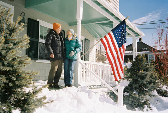 Lifestyle Senior couple Portrait home American Flag 