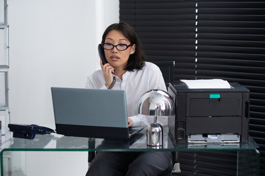 Asian business woman at office.