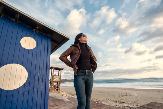 Casually Dressed Woman Enjoying the Day in the Sun