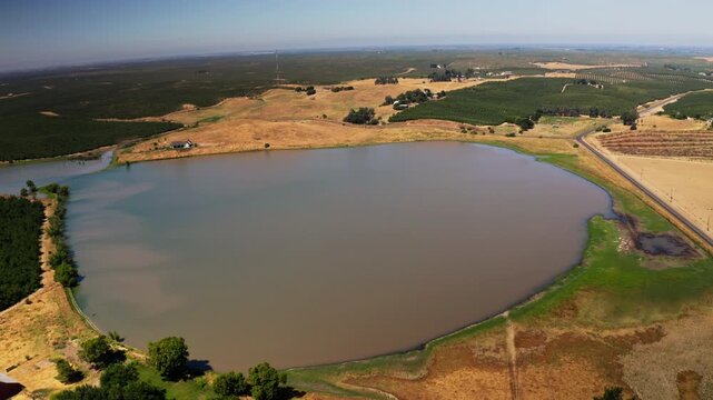 Drone view of a River running through farmland in Modesto, California