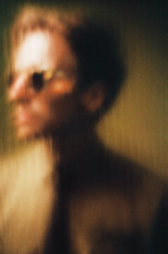 Blurred Silhouette Behind Glass